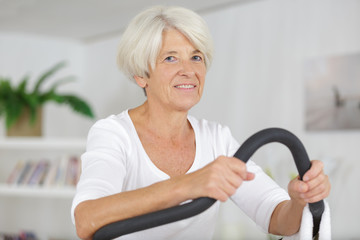 mature lady exercising on step machine
