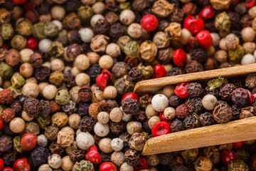 mix of peppercorns on white acrylic background