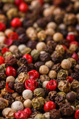 mix of peppercorns on white acrylic background