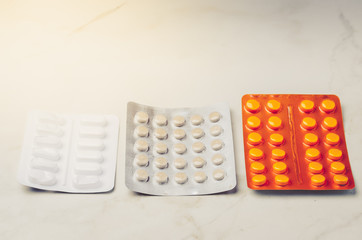 pills packages on white background/Packages of pills are placed on a white background.