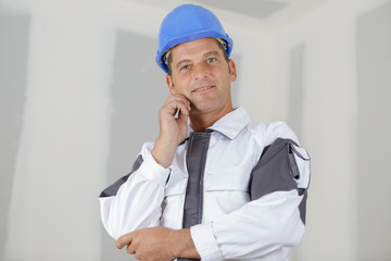 happy builder in working uniform