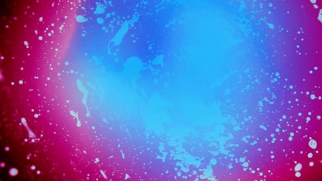 Beautiful spinning red and blue ink pattern liquid art
