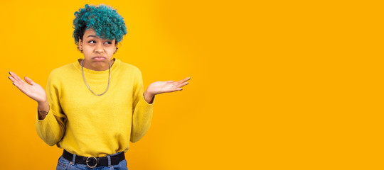 young african american girl or woman isolated on color background with space for advertisement or...