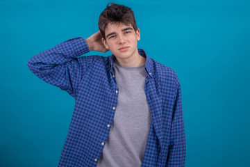 young male teenager or student in casual style isolated on color background