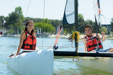 young couple sailing in andaman sea at sunny day