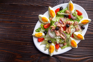 tuna salad on dark wooden rustic background