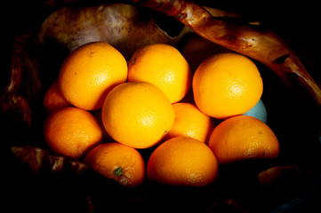 A bunch of oranges on a black background