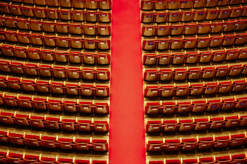 Naklejka premium Hall with red carpet and armchairs on the sides of the famous theater in Vienna.