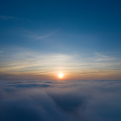 Yellow and blue dawn over clouds, concept, travel and leisure.