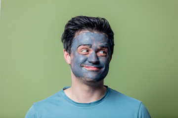 guy in a face care mask