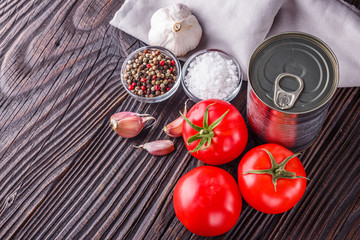 juicy canned tomatoes on wooden rustic background