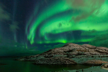 Northern lights on the arctic sky. Hillesoya, Sommaroya.
