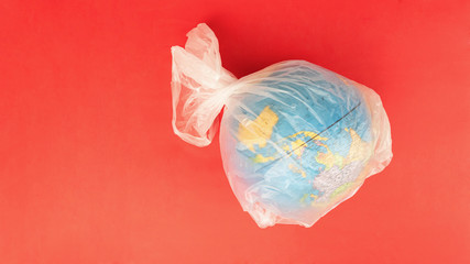 Globe wrapped in transparent plastic bag