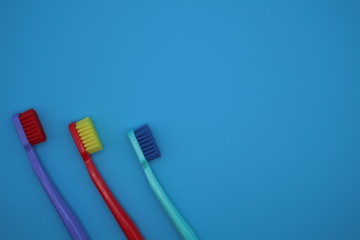 Tooth brushes on blue background