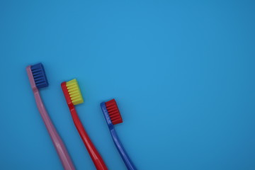 Tooth brushes on blue background