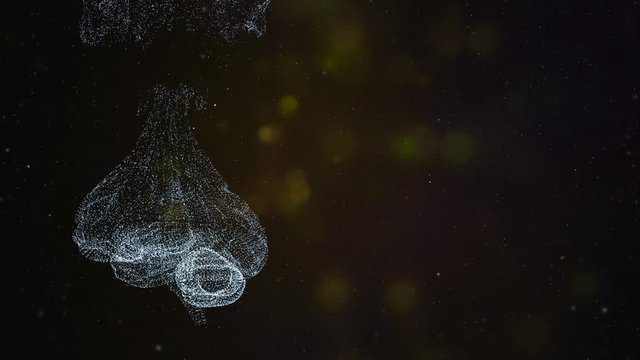 Abstract human brain from glittering particles floating and exploding on a black background.