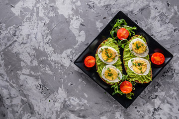 tasty and nutritious avocado sandwich and boiled egg