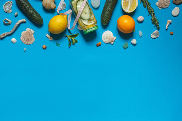 Sassi water, cooking ingredients, centimeter, seashells,pebbles on a blue background,horizontally with space