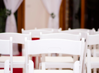 Row of white chairs