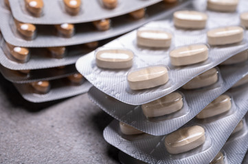 Foil blister packages with pills, medical background
