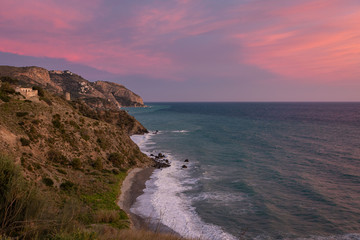 Landscape of a rocky coast with sunset colors