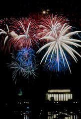 Fireworks light up the sky over the Lincoln Memorial as seen from the Virginia side of the Potomac River. 