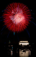 Fireworks light up the sky over the Lincoln Memorial as seen from the Virginia side of the Potomac River. 