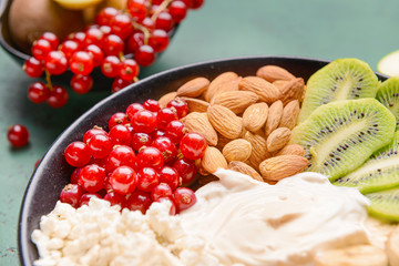 Bowl with tasty salad on table, closeup