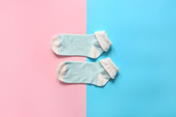 Cotton socks on color background