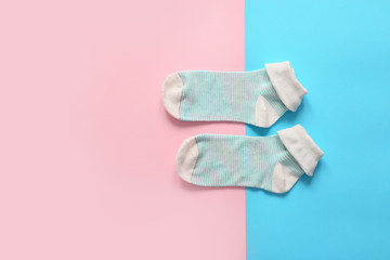 Cotton socks on color background