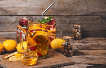Mason jar of cold tea on wooden table