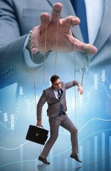 Businessman puppet being manipulated by boss