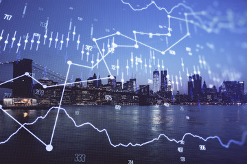 Financial graph on night city scape with tall buildings background double exposure. Analysis concept.