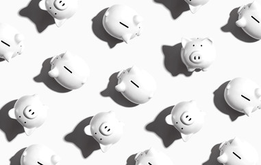 White piggy banks overhead view - flat lay