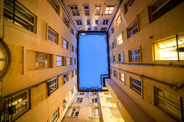 Traboule in Lyon. Original and symetrical shot of buildings and blue sky