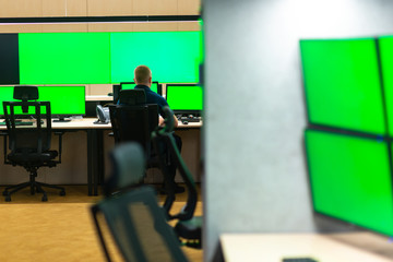 Male operator watching the cctv monitors