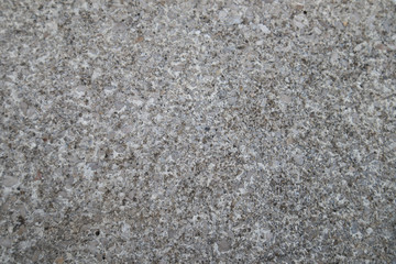 Close-up of a gray ground and grainy texture