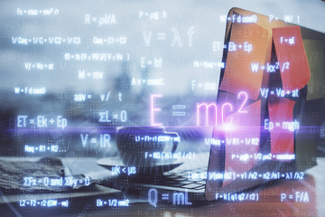 Desktop computer background and formula hologram writing. Double exposure. Education concept.