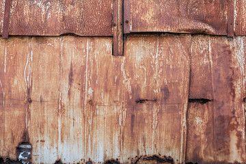 Old rusty metal sheet. The rusty metal background.