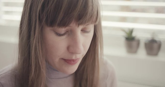 Woman inhales asthma inhaler virus coronavirus at home quarantine close up