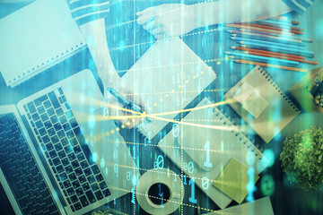 Double exposure of hands making notes with digital coding icons. Computer learning concept.