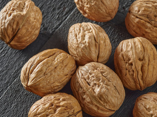 Walnuts lie on a light colored background