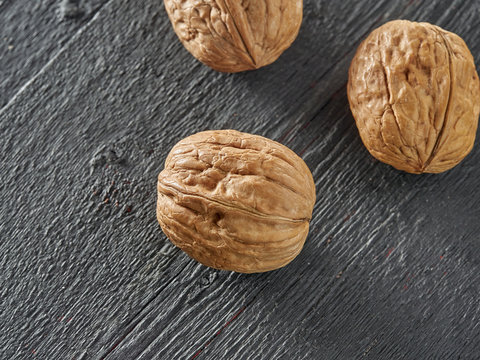 Walnuts lie on a light colored background