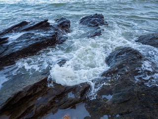 Waves coming to the rocky shore
