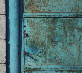 Metal door with vintage handles and rust with space for text