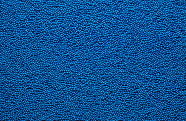 Abstract background texture of repeating spherical objects of different shades of blue