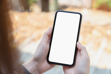 Hand holding blank screen of smartphone and for graphic display montage.