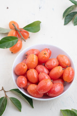 Elaeagnus berry in white bowl on backdrop,copy space,fruit of thailand