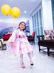 asian little girl Wearing yukata in house with balloon