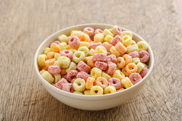 Cereal flakes in bowl with copy space,Breakfast concept.Food with delicious fruity taste and fruity colours.It's made with maize,wheat,and barley
